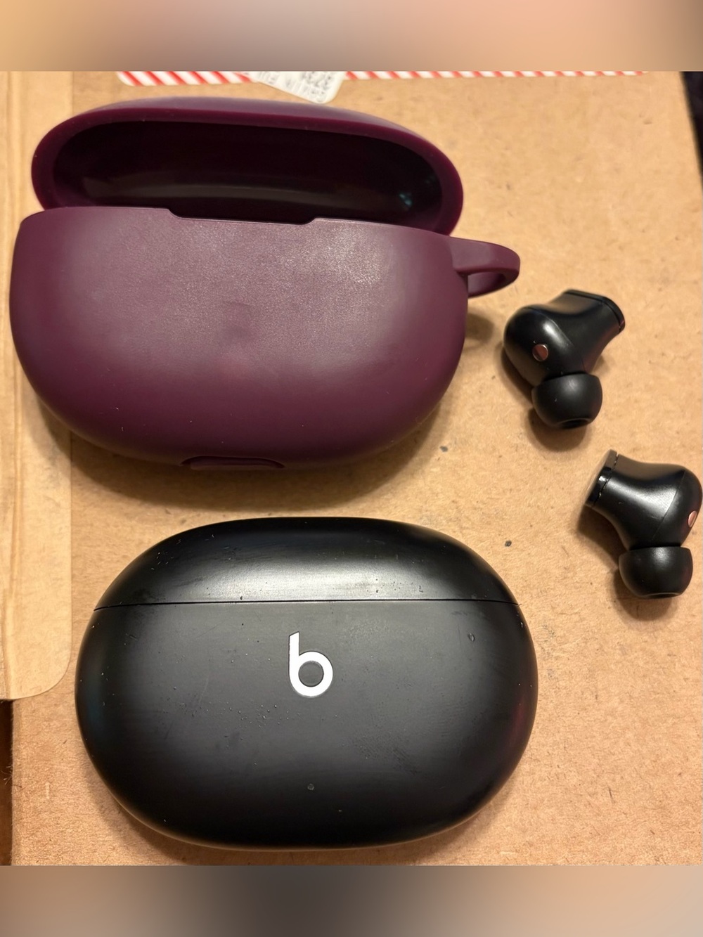 Beats Studio buds with Charging Case - Black and a plum case